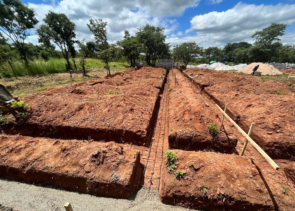 Footings dug in the dirt before cement has been added.